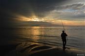 vissen bij zonsondergang